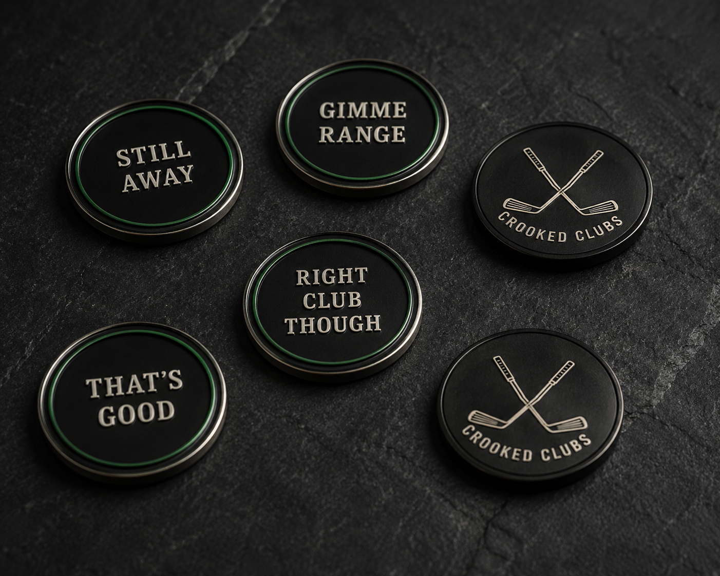 Four ball markers in a black tin: Still Away, Breakfast Ball, That's Good, Gimme Range