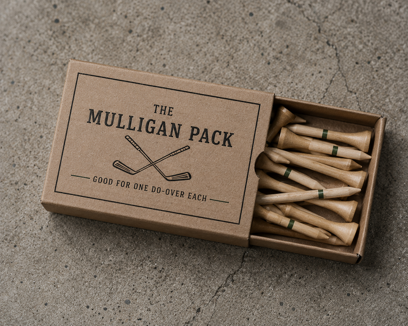 Kraft box of wood tees labeled The Mulligan Pack, good for one do-over each